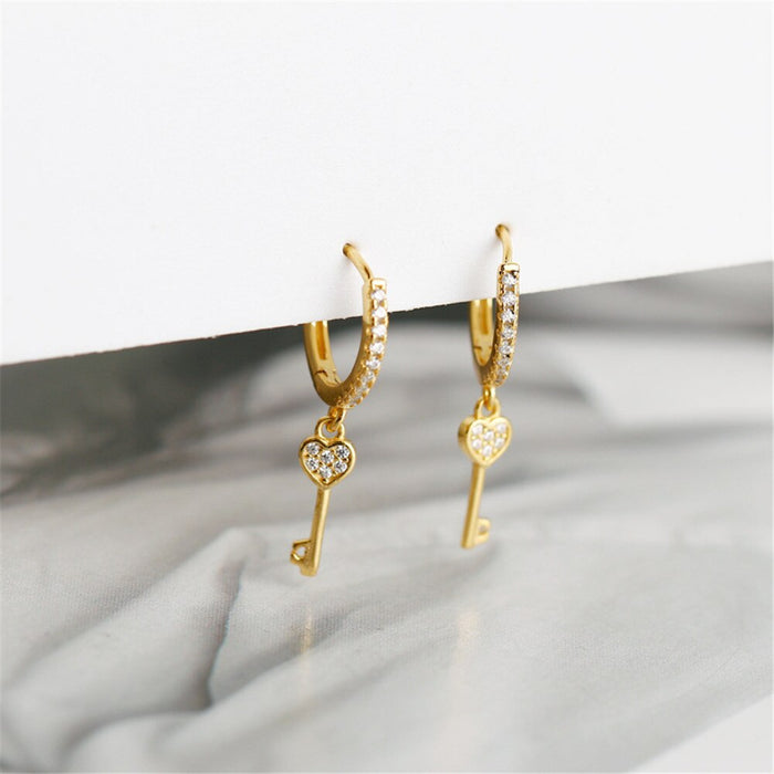 Orecchini a cerchio Key of Love in oro