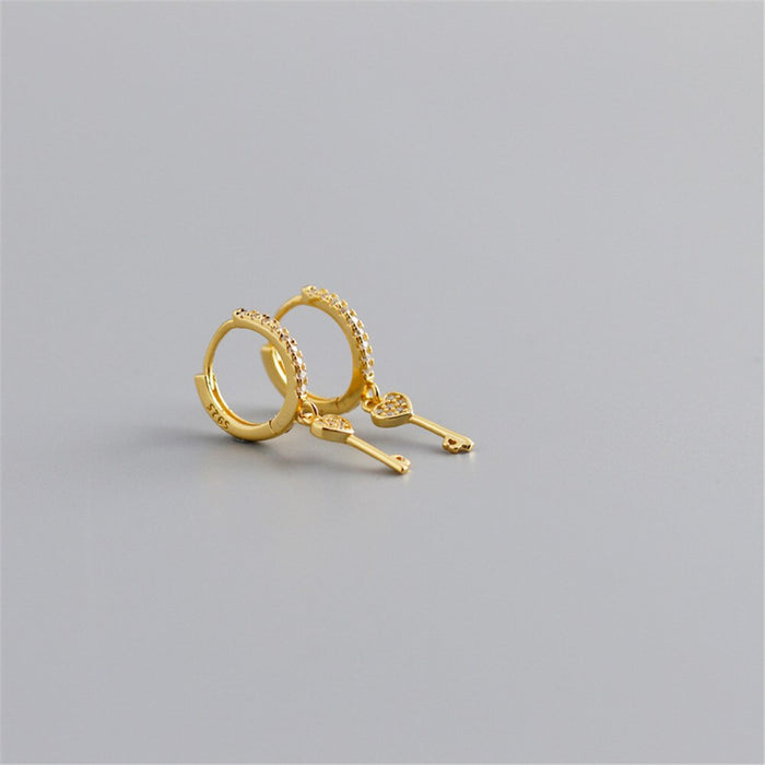 Orecchini a cerchio Key of Love in oro