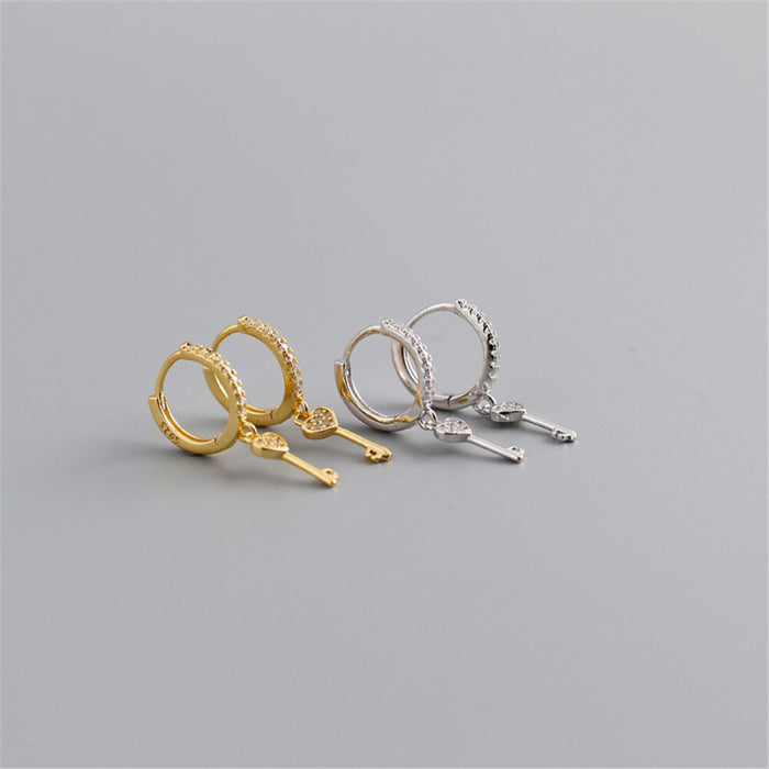 Orecchini a cerchio Key of Love in oro