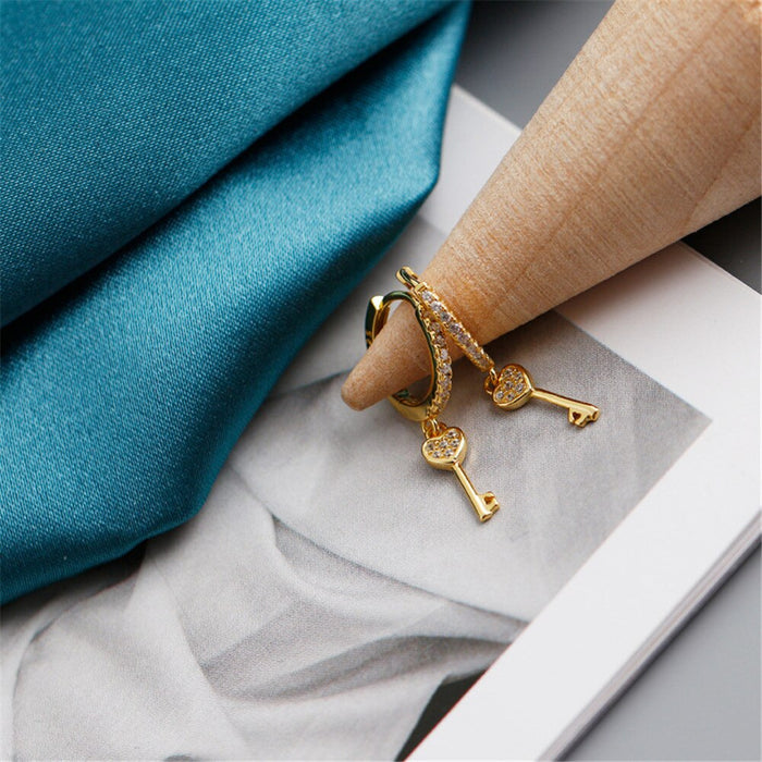 Orecchini a cerchio Key of Love in oro