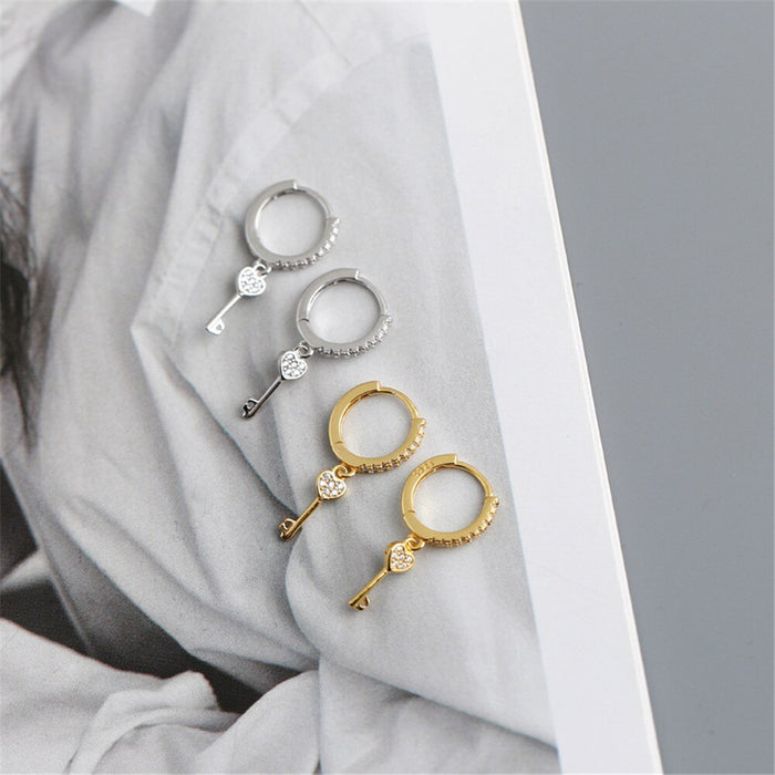 Orecchini a cerchio Key of Love in oro
